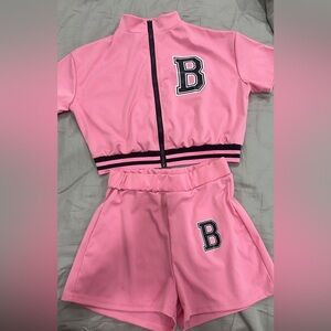 Like new, wore once Varsity two piece short set, small. Beautiful pink